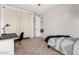 Bedroom featuring a ceiling fan, gray walls, and desk area at 30246 N 123Rd Ln, Peoria, AZ 85383