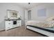 Bedroom featuring a platform bed and a light-colored wood dresser with a mirror at 30246 N 123Rd Ln, Peoria, AZ 85383