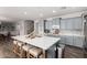 Beautiful kitchen with a large island, pendant lighting, and light grey cabinets at 30246 N 123Rd Ln, Peoria, AZ 85383
