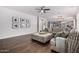 Relaxing living room with dark hardwood floors and neutral decor, perfect for unwinding after a long day at 30246 N 123Rd Ln, Peoria, AZ 85383