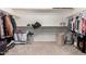 Spacious walk-in closet with ample shelving and storage space, perfect for organization at 30246 N 123Rd Ln, Peoria, AZ 85383