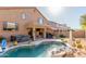 The backyard boasts a private pool, spa, covered patio, and easy access to a grill for outdoor enjoyment at 3206 W Sentinel Rock Rd, Phoenix, AZ 85086