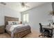 Bright bedroom with a ceiling fan, a desk space, and a comfortable bed at 3206 W Sentinel Rock Rd, Phoenix, AZ 85086