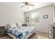 Relaxing bedroom with ceiling fan, neutral walls and light, and warm-toned carpet at 3206 W Sentinel Rock Rd, Phoenix, AZ 85086