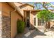 Warm entryway with a stylish front door, desert landscaping and ample natural light at 3206 W Sentinel Rock Rd, Phoenix, AZ 85086