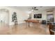 Large game room includes a pool table, TV, ceiling fan, and game machine at 3206 W Sentinel Rock Rd, Phoenix, AZ 85086