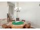 Bright game room features a table with a green felt top under a chandelier at 3206 W Sentinel Rock Rd, Phoenix, AZ 85086