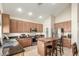 The kitchen features an island with seating, stainless appliances, and a pantry at 3206 W Sentinel Rock Rd, Phoenix, AZ 85086
