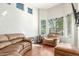 Bright living room featuring hardwood floors, neutral walls, and large windows at 3206 W Sentinel Rock Rd, Phoenix, AZ 85086