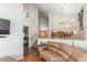 Cozy living room featuring a fireplace and stairs leading to the upper level at 3206 W Sentinel Rock Rd, Phoenix, AZ 85086