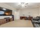 Large living room with a ceiling fan, a TV, desk space and comfortable seating at 3206 W Sentinel Rock Rd, Phoenix, AZ 85086
