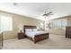 Spacious main bedroom featuring textured walls, a ceiling fan, and natural light from large windows at 3206 W Sentinel Rock Rd, Phoenix, AZ 85086