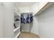 Walk-in closet with built-in shelving and ample space for organization at 3206 W Sentinel Rock Rd, Phoenix, AZ 85086