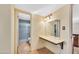 Bathroom vanity with a granite countertop and decorative tile shower at 3220 W Laurie Ln, Phoenix, AZ 85051