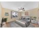 Inviting bedroom features a comfortable bed, neutral decor, natural light, and a ceiling fan for added comfort at 3220 W Laurie Ln, Phoenix, AZ 85051
