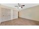 Bedroom features wood-look tile flooring and multiple closets at 3220 W Laurie Ln, Phoenix, AZ 85051