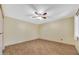 Bedroom with natural light, tile floors, ceiling fan, and a window at 3220 W Laurie Ln, Phoenix, AZ 85051