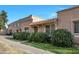 A view of the building, highlighting the sidewalk and landscaping at 3220 W Laurie Ln, Phoenix, AZ 85051