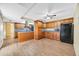 Spacious kitchen boasts wood cabinets, stainless hood, modern appliances, and tile flooring at 3220 W Laurie Ln, Phoenix, AZ 85051