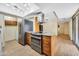 Well-equipped kitchen with stainless steel appliances and tiled floors at 3220 W Laurie Ln, Phoenix, AZ 85051