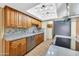 Modern kitchen featuring ample cabinet space and stainless steel appliances at 3220 W Laurie Ln, Phoenix, AZ 85051