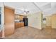 Bright kitchen featuring wood cabinets, modern appliances, and wood-look tile flooring at 3220 W Laurie Ln, Phoenix, AZ 85051
