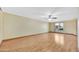 Bright living room features wood flooring and a ceiling fan at 3220 W Laurie Ln, Phoenix, AZ 85051