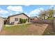View of the backyard showcasing desert landscaping and block wall fencing at 3305 E Hononegh Dr, Phoenix, AZ 85050