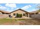 View of the backyard showcasing desert landscaping and block wall fencing at 3305 E Hononegh Dr, Phoenix, AZ 85050