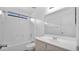 Bathroom featuring a shower-tub combo, toilet, sink, and large mirror at 3305 E Hononegh Dr, Phoenix, AZ 85050