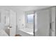 Bathroom with a soaking tub, shower, and bright window at 3305 E Hononegh Dr, Phoenix, AZ 85050
