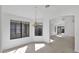 Open dining area featuring large window and view into other rooms at 3305 E Hononegh Dr, Phoenix, AZ 85050