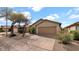 Charming single-story home with well-maintained landscaping and a two-car garage at 3305 E Hononegh Dr, Phoenix, AZ 85050