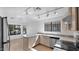 Bright kitchen with granite countertops, stainless steel appliances and tile flooring at 3305 E Hononegh Dr, Phoenix, AZ 85050