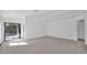 Bright and airy living room with sliding glass doors to a backyard at 3305 E Hononegh Dr, Phoenix, AZ 85050