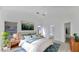 Bright main bedroom featuring high ceilings, neutral tones, and ensuite bathroom at 3305 E Hononegh Dr, Phoenix, AZ 85050
