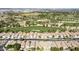 Aerial view of the golf course with houses surrounded by trees and green fairways at 3310 E Fremont Rd, Phoenix, AZ 85042