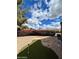 View of the backyard featuring a putting green, landscaping and other backyard elements at 3310 E Fremont Rd, Phoenix, AZ 85042