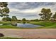 Picturesque golf course featuring lush greenery, trees, pond, and well-manicured fairways at 3310 E Fremont Rd, Phoenix, AZ 85042