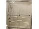 Shower featuring a sliding glass door and grab bars at 3310 E Fremont Rd, Phoenix, AZ 85042