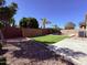 An expansive backyard features a pool, artificial turf, decorative rock, and a paved area at 3717 E Lodgepole Dr, Gilbert, AZ 85298