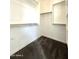 Walk-in closet featuring carpeted floor, ample shelving, and closet rods for organized storage at 3717 E Lodgepole Dr, Gilbert, AZ 85298