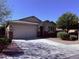 Charming single-story home with a well-manicured lawn and a two-car garage, offering great curb appeal at 3717 E Lodgepole Dr, Gilbert, AZ 85298