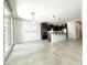 Spacious open-concept kitchen with tile floors, island seating, stainless appliances, and seamless access to the outdoors at 3717 E Lodgepole Dr, Gilbert, AZ 85298