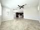 Bright living room with open layout, tile floors, leading to a well-appointed kitchen with island seating at 3717 E Lodgepole Dr, Gilbert, AZ 85298