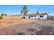 A spacious backyard with a fire pit, block fence and desert landscape at 3718 W Columbine Dr, Phoenix, AZ 85029