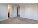 Bedroom with ensuite bathroom access, closet, and simple design at 3718 W Columbine Dr, Phoenix, AZ 85029