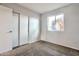 Comfortable bedroom features a window with a view, closet with sliding doors, and carpet flooring at 3718 W Columbine Dr, Phoenix, AZ 85029