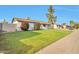 Well-maintained single-story home with a spacious front yard and a mature tree in a quiet neighborhood at 3718 W Columbine Dr, Phoenix, AZ 85029