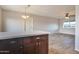 Bright kitchen with a breakfast bar that opens up to the living room with an open concept design at 3718 W Columbine Dr, Phoenix, AZ 85029